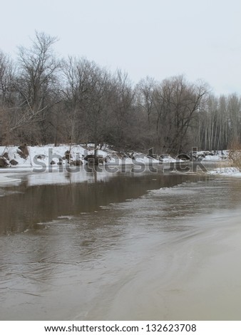 River flood in the march overcast day