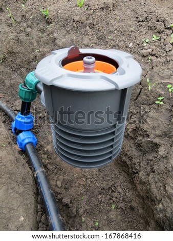 Installation of a modern advanced connecting point with aqua stop of an underground sprinklersystem