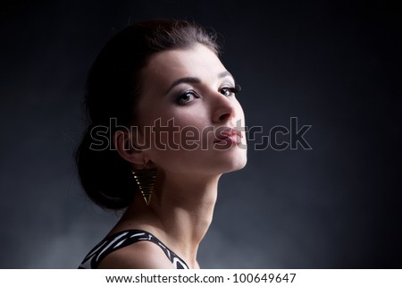 Portrait of luxury woman in exclusive jewelry on black background