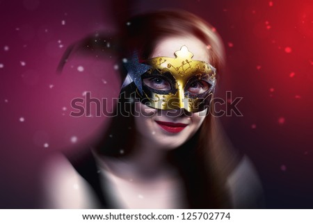 Young woman  wearing  carnival venetian mask on blur background. Masquerade.