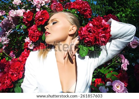 Beauty woman with bunch flowers. Professional Makeup and hairstyle