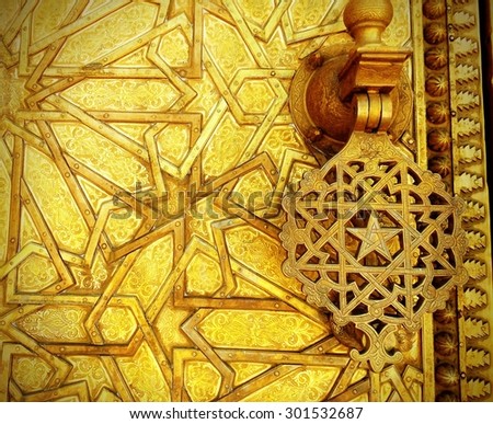 golden palace door in fes, morocco