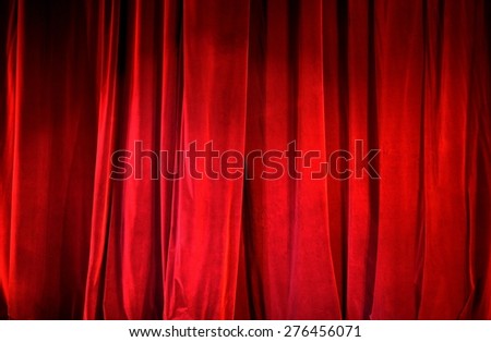 Part of a lighted red curtain. Ideal to use as background.