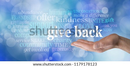 GIVE BACK word tag cloud - male hand with the words GIVE BACK floating above surrounded by a word cloud against a blue bokeh background