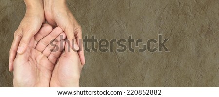 Male and female hands in gentle embrace on parchment banner background