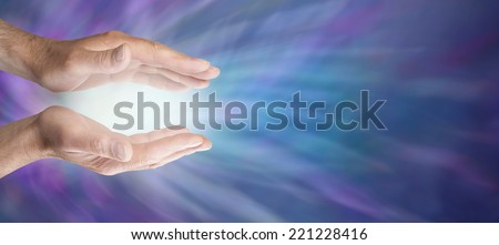 Healing hands and blue energy website banner  -   Male Healing hands outstretched with soft white energy between on a blue energy background