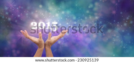 Make a Wish for 2015 Celebration Banner - Hands outstretched with a white 2015 floating above on a blue sparkly bokeh wide background banner