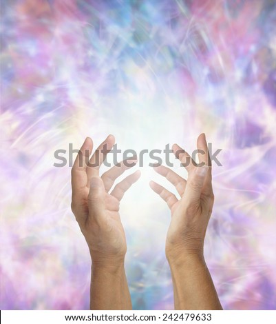 Sensing Energy -  Pair of female hands reaching out surrounded by  an chaotic energy matrix formation background