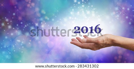 Welcome 2016 Celebration Banner - Female hands outstretched facing upwards with \'2016\' floating above on a blue sparkly flowing bokeh wide background banner and plenty of copy space on left hand side