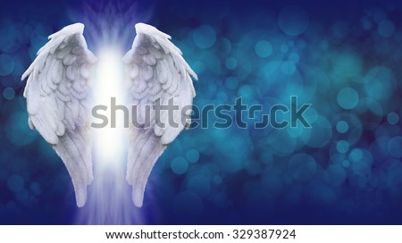 Angel Wings on Blue Bokeh Banner    - Wide blue bokeh background with a large pair of Angel Wings on the left side and a shaft of bright light between