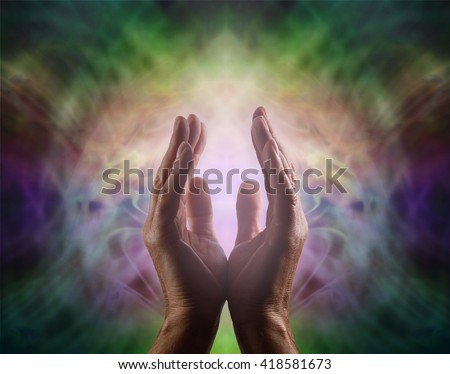 Pranic healer with beautiful Aura -  Complex multicolored vignette energy field with male hands reaching up and a gentle pink light between