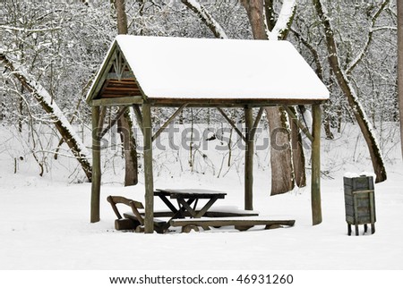 Snow covered resting place in the forest
