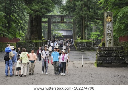 NIKKO, JAPAN - JUNE 22: Tourists walk at Toshogu shrine entrance on June 22, 2008 in Nikko, Japan. Toshogu is  World Heritage site and contains five structures that are JPN National Treasures.