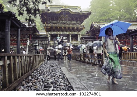 NIKKO, JAPAN - JUNE 22: Visitors walk under rain at Toshogu shrine on June 22, 2008 in Nikko, Japan. Toshogu is  World Heritage site and contains five structures that are JPN National Treasures.