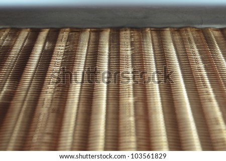 fragment of industrial copper air heat exchanger: focus on top part of radiator