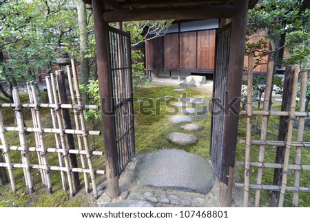 stone steps and open gate in Japanese Zen garden in Kyoto