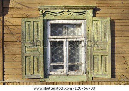 old style window with open wooden shutters