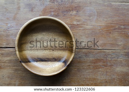 scenic empty wooden bowl on the vintage table top