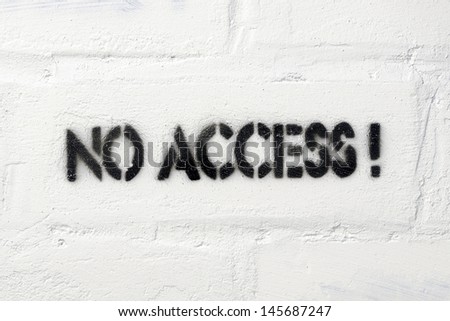 no access exclamation stencil print on the white brick wall