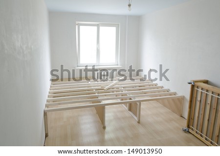 empty room interior under construction with building upper floor wooden frame structure