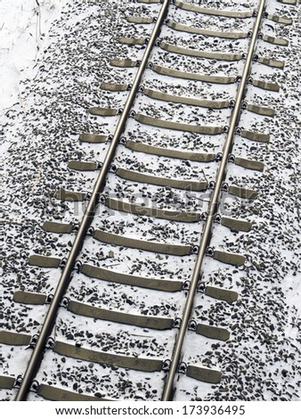 railway tracks fragment covered by fresh snow