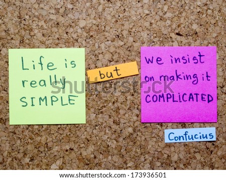famous Confucius quote interpretation with sticker notes on cork board