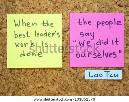 famous Lao Tzu quote interpretation with sticker notes on cork board