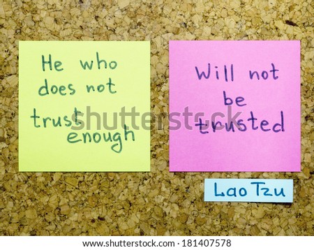 famous Lao Tzu quote interpretation with sticker notes on cork board