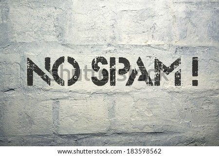 no spam exclamation stencil print on the grunge white brick wall