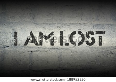 I am lost black stencil print on the grunge brick wall with gradient effect