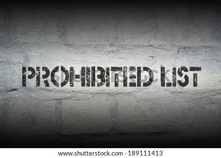 prohibited list black stencil print on the grunge brick wall with gradient effect