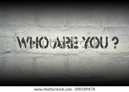 who are you stencil print on the grunge white brick wall