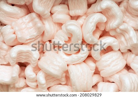 many soft polystyrene fill packaging particles background