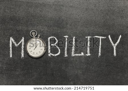 mobility word handwritten on chalkboard with vintage precise stopwatch used instead of O
