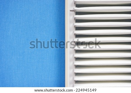 clean vehicle air filter fragment over blue textile material background