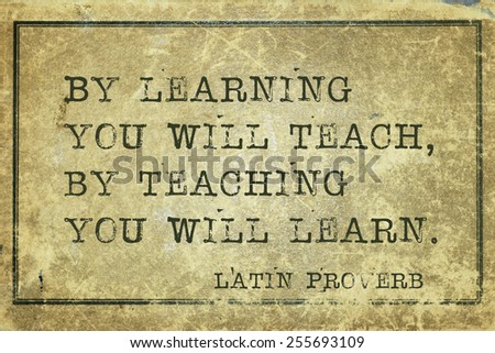 By learning you will teach, by teaching you will learn -  ancient Latin proverb printed on grunge vintage cardboard