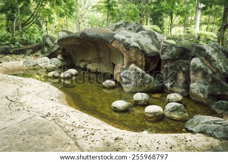 prehistoric landscape with scenic stone cliffs and caverns in Singapore Botanical garden