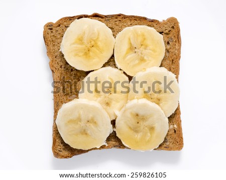 square toast with banana slices and honey isolated on white