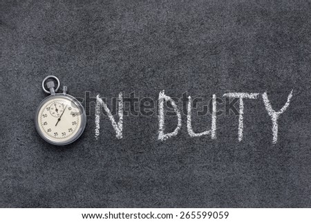 on duty phrase handwritten on chalkboard with vintage precise stopwatch used instead of O
