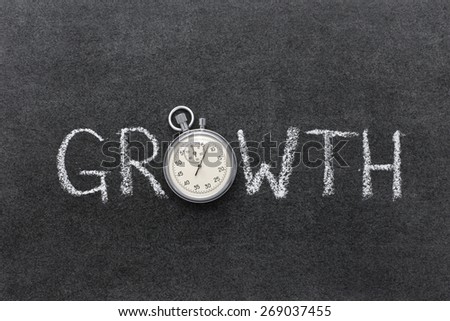 growth concept handwritten on chalkboard with vintage precise stopwatch used instead of O