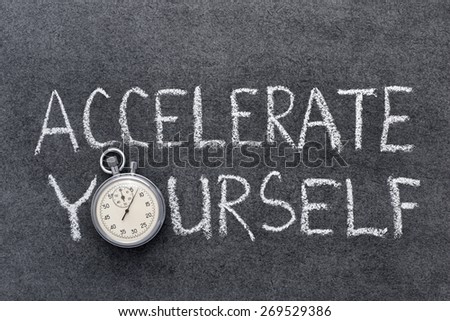 accelerate yourself phrase handwritten on chalkboard with vintage precise stopwatch used instead of O