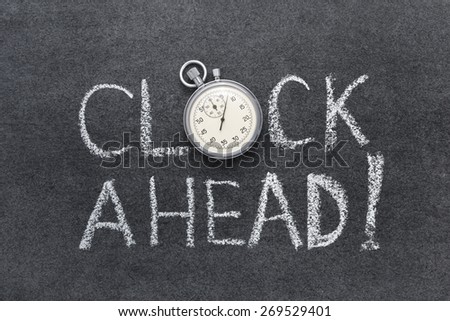 clock ahead phrase handwritten on chalkboard with vintage precise stopwatch used instead of O