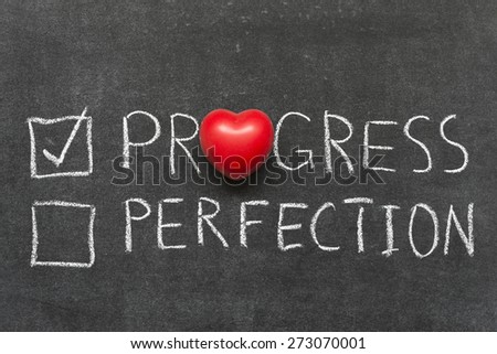 choose progress not perfection concept handwritten on blackboard with heart symbol instead of O