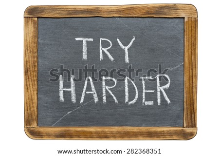 try harder slogan handwritten on vintage slate chalkboard isolated on white