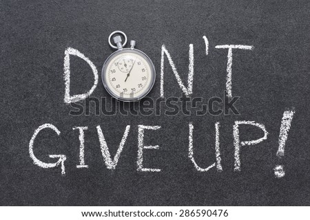 don`t give up exclamation handwritten on chalkboard with vintage precise stopwatch used instead of O