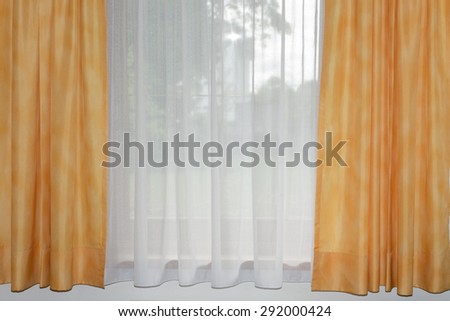 transparent home curtain with window behind
