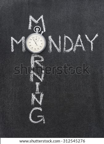 Monday morning phrase handwritten on chalkboard with vintage precise stopwatch used instead of O