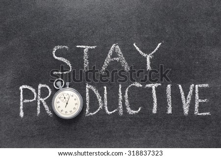 stay productive phrase handwritten on chalkboard with vintage precise stopwatch used instead of O
