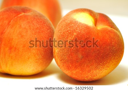 fresh detailed peaches background, focus on the front one