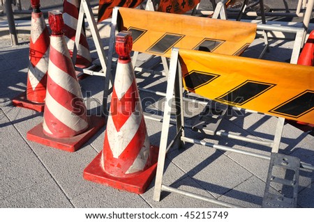 prohibition cones and temporary signs placed on pavement in road construction area